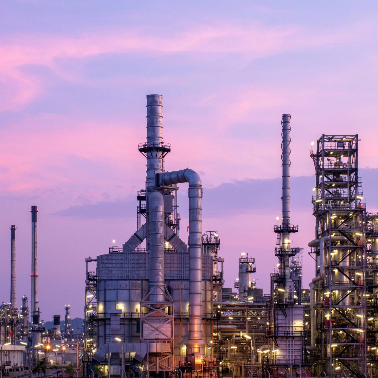 The morning sky view of the oil refinery and petrochemical plants, the natural gas tank in the night sky background
